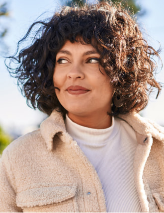 Smiling woman with curly hair